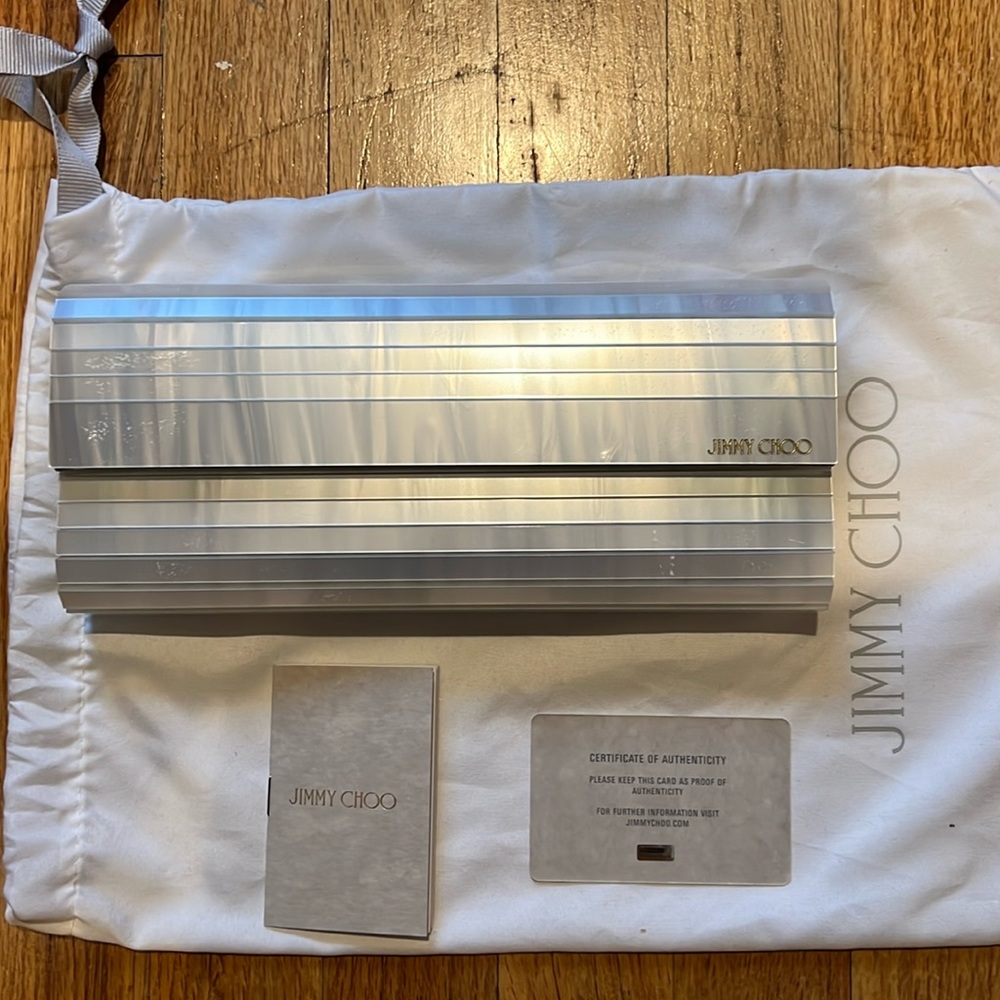 Jimmy Choo sweetie clutch. Brand new, never worn. Plastic still on the clasp.